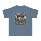 Where Our Stories Get Better Youth Tee – Kids' Comfort Colors Mountain Adventure Shirt in Blue Jean – flat lay