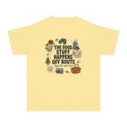 The Good Stuff Happens Off Route Youth Tee – Kids' Comfort Colors Road Trip Shirt in Butter – flat lay