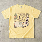 Planned With Love Lived Together Travel Mom Shirt in Butter – flat lay