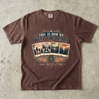 This Is How We Keep the Years Family Trip Shirt in Espresso – flat lay