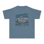 Greetings from the Mountains Family Getaway Youth Tee – Kids' Comfort Colors Cabin Weekend Shirt in Blue Jean – flat lay