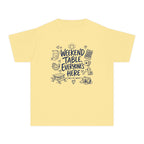 Weekend Table Everyone's Here Youth Tee – Kids' Comfort Colors Family Getaway Shirt in Butter – flat lay