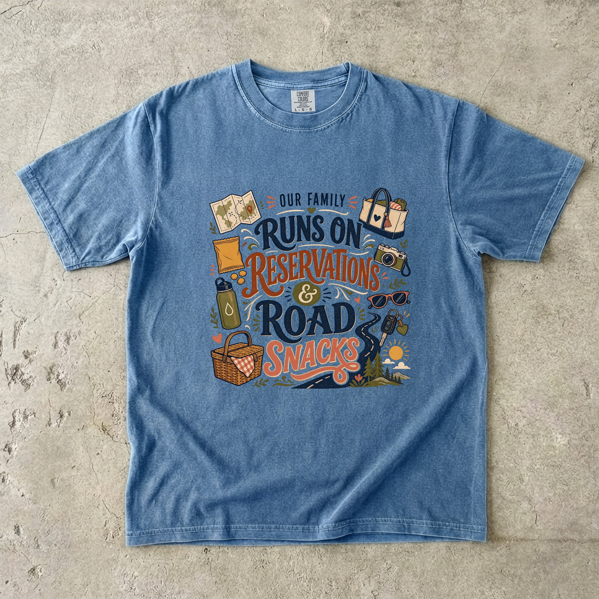 Our Family Runs on Reservations and Road Snacks Road Trip Shirt in Blue Jean – flat lay