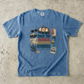 Pack the Bags Keep the Stories Family Getaway Shirt in Blue Jean – flat lay