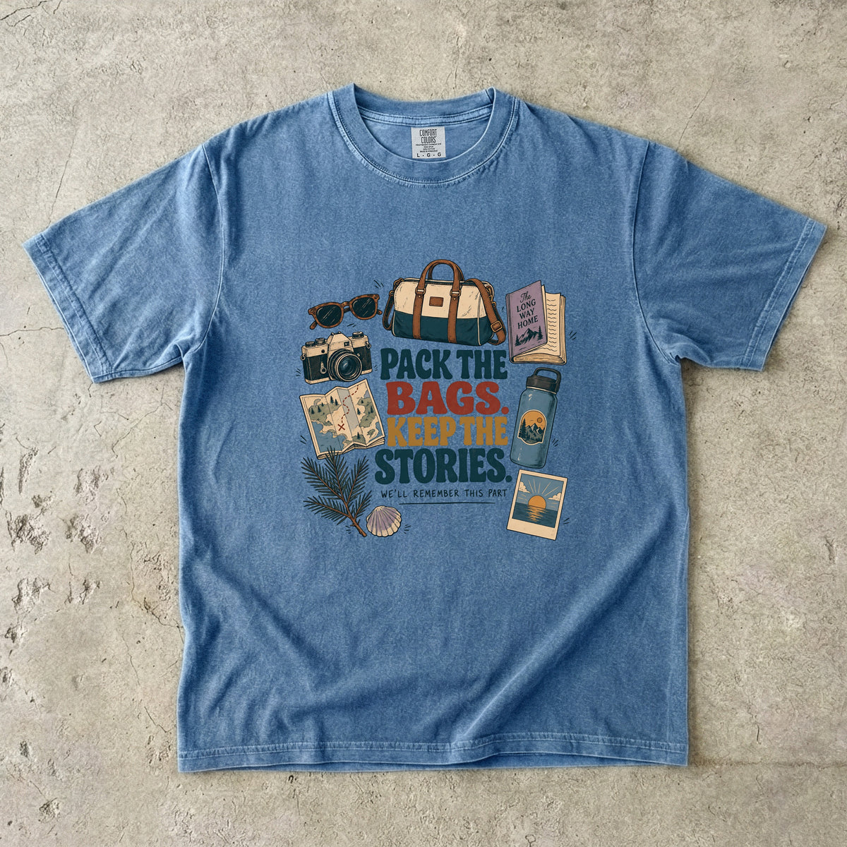 Pack the Bags Keep the Stories Family Getaway Shirt in Blue Jean – flat lay
