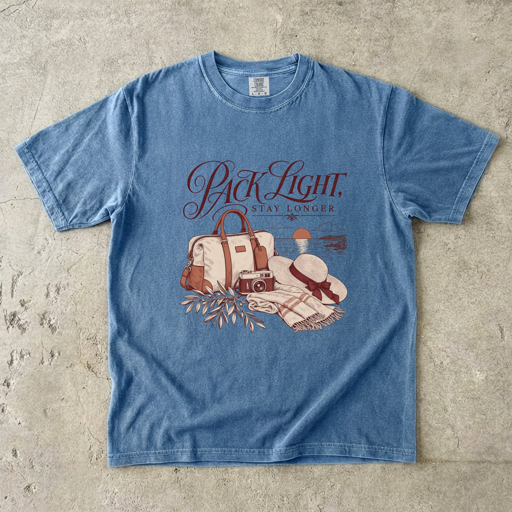 Pack Light Stay Longer Girls Trip Shirt in Blue Jean – flat lay