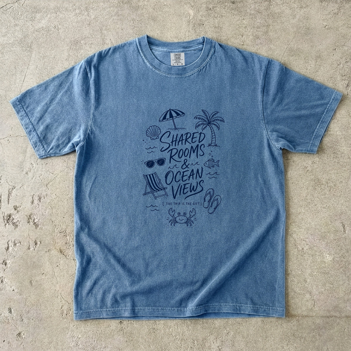 Shared Rooms and Ocean Views Girls Trip Shirt in Blue Jean – flat lay