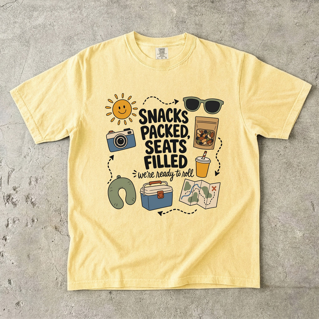 Snacks Packed Seats Filled Road Trip Shirt in Butter – flat lay