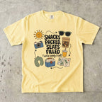 Snacks Packed Seats Filled Road Trip Shirt in Butter – flat lay