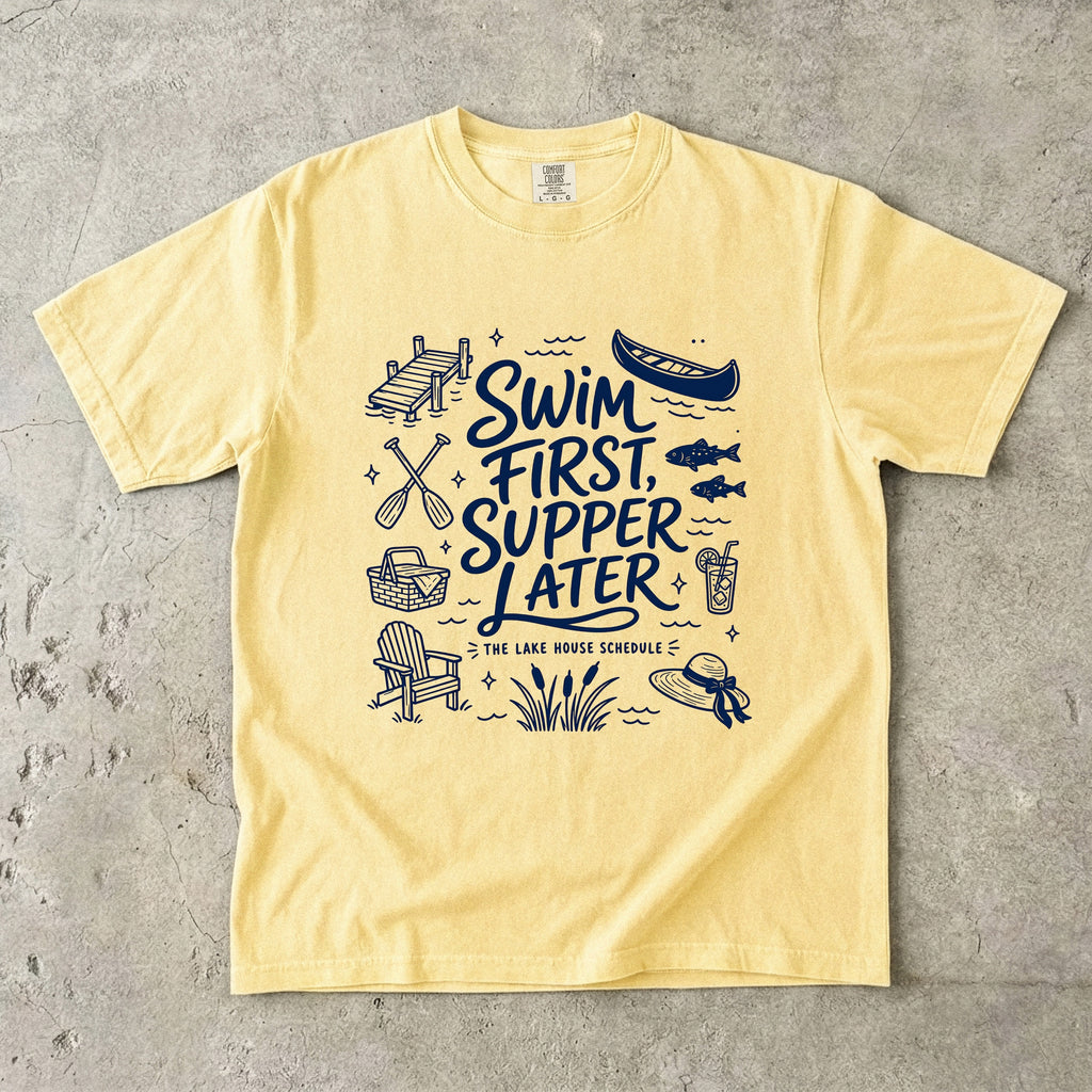 Swim First Supper Later Lake Vacation Shirt in Butter – flat lay