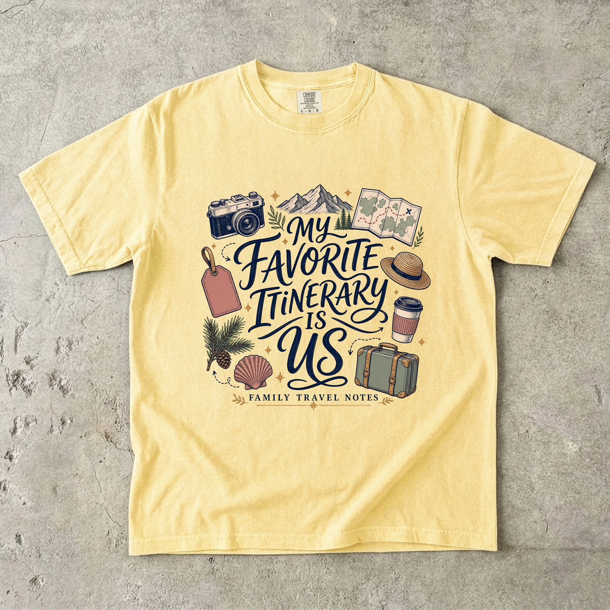 My Favorite Itinerary Is Us Travel Mom Shirt in Butter – flat lay