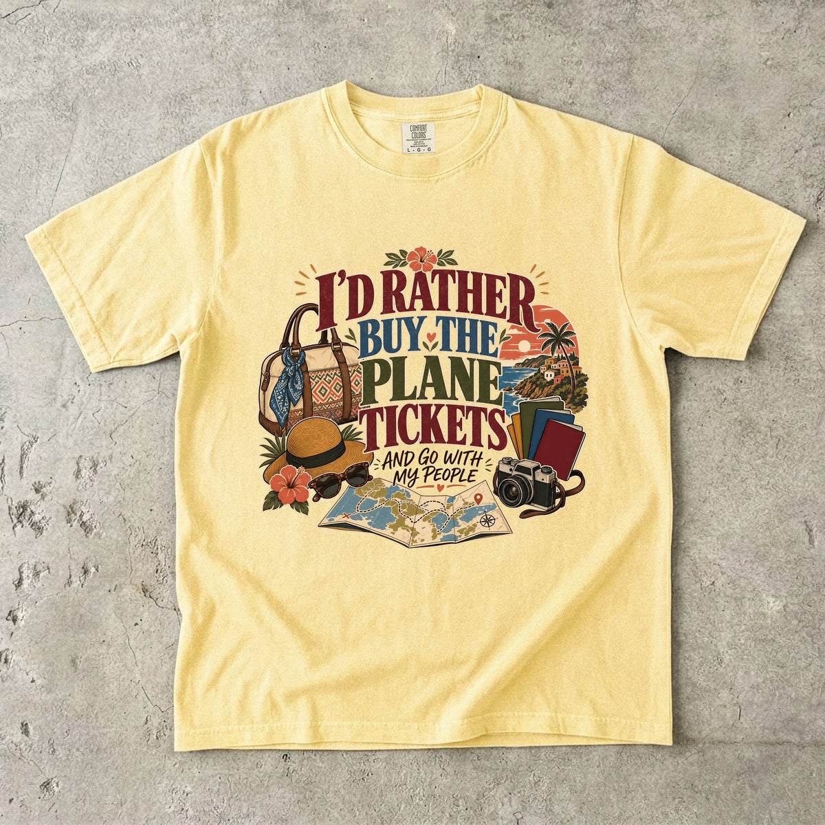 I'd Rather Buy the Plane Tickets Travel Mom Shirt in Butter – flat lay