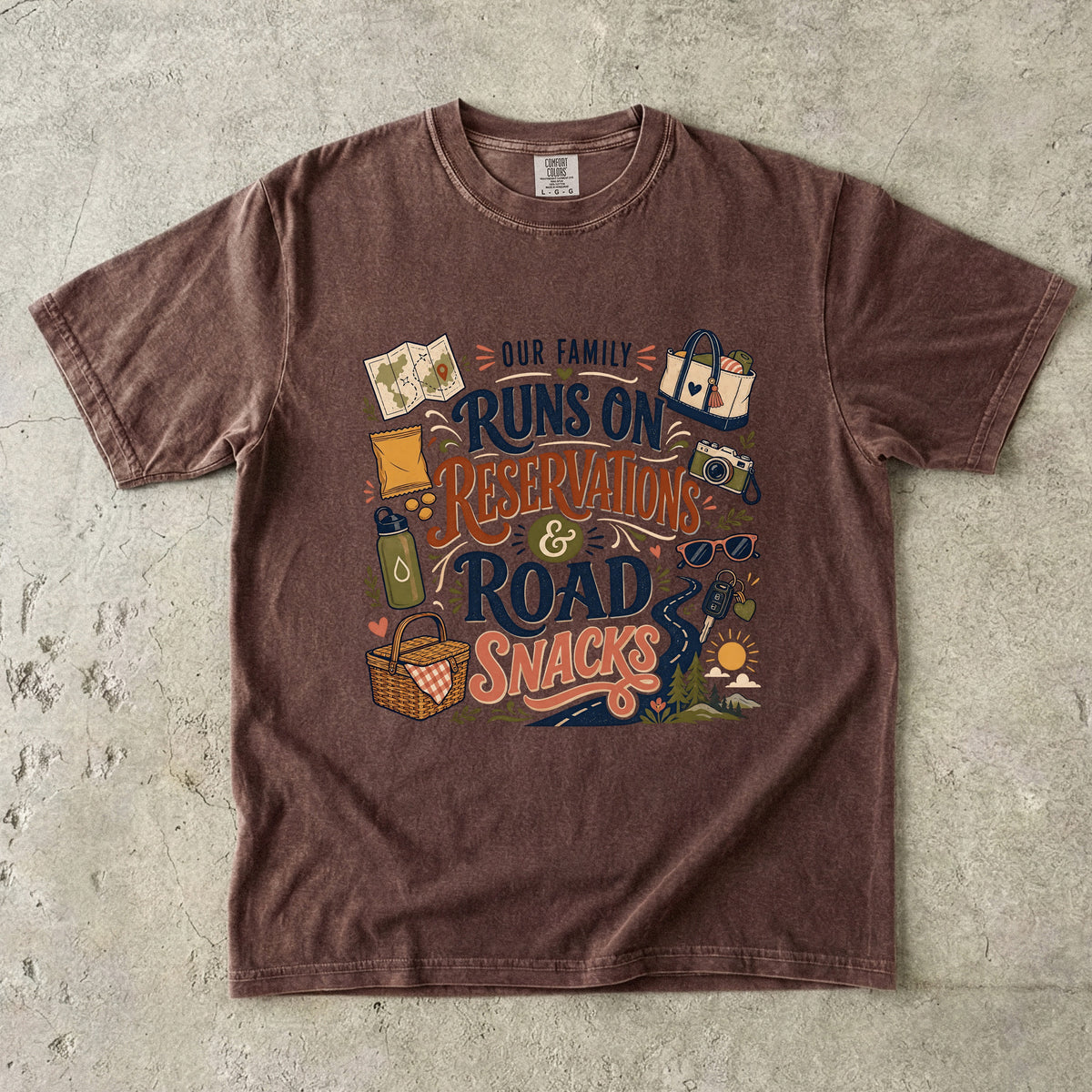 Our Family Runs on Reservations and Road Snacks Road Trip Shirt in Espresso – flat lay