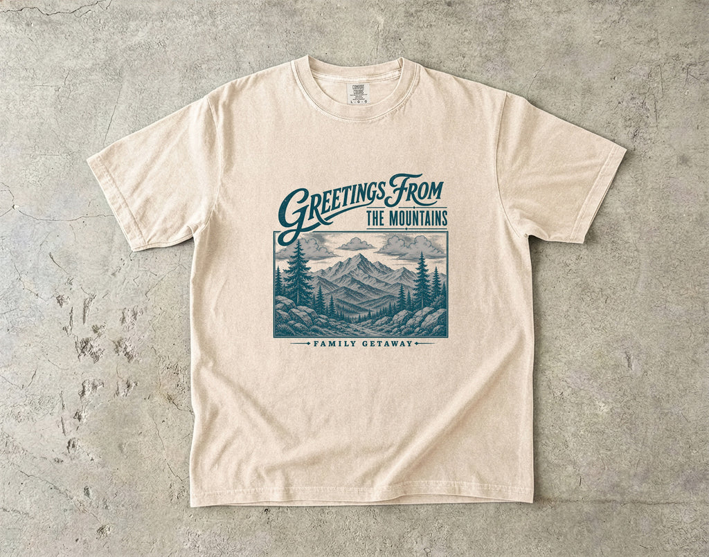Greetings from the Mountains Family Getaway Shirt in Ivory – flat lay