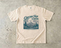 Greetings from the Mountains Family Getaway Shirt in Ivory – flat lay