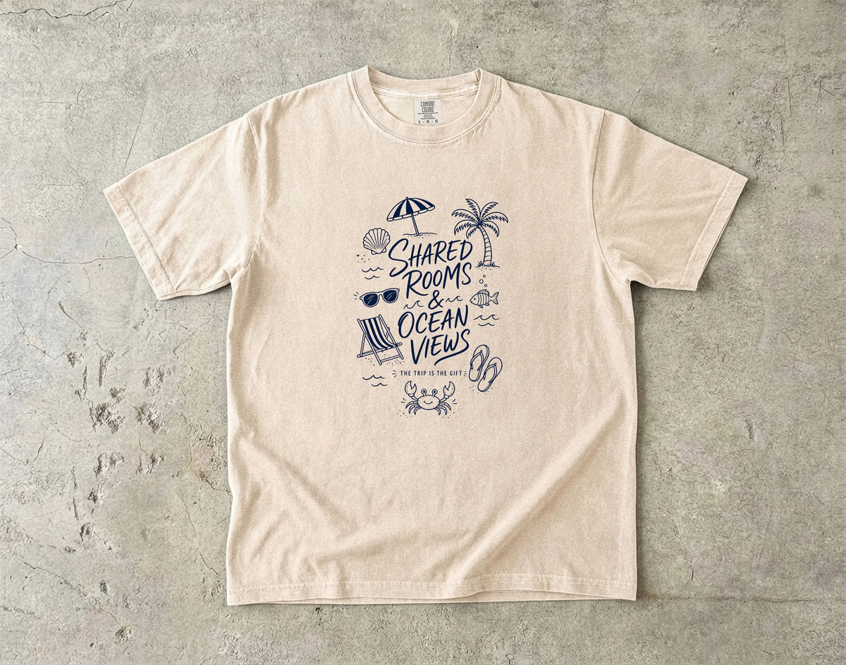 Shared Rooms and Ocean Views Girls Trip Shirt in Ivory – flat lay