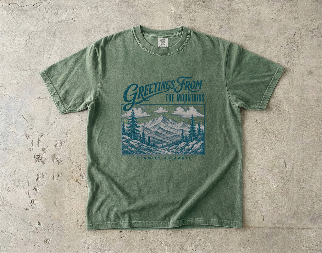 Greetings from the Mountains Family Getaway Shirt in Moss – flat lay