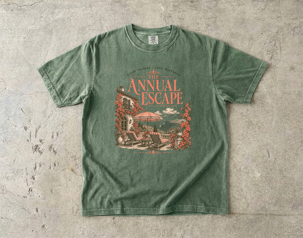 The Annual Escape Girls Trip Shirt in Moss – flat lay