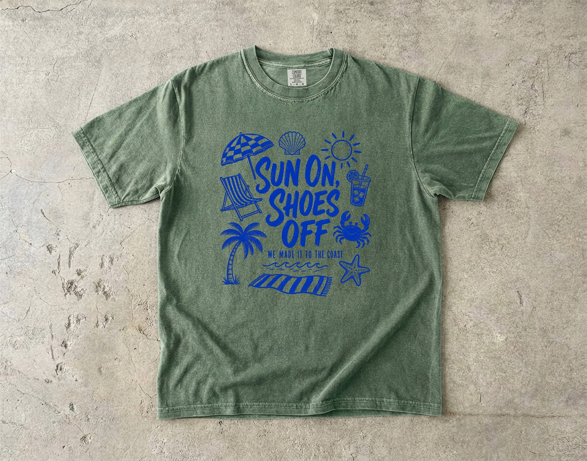 Sun On Shoes Off Beach Vacation Shirt in Moss – flat lay