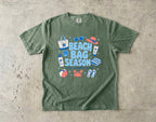 Beach Bag Season Beach Vacation Shirt in Moss – flat lay