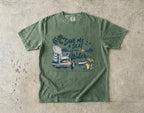 Save Me a Seat by the Water Lake Vacation Shirt in Moss – flat lay