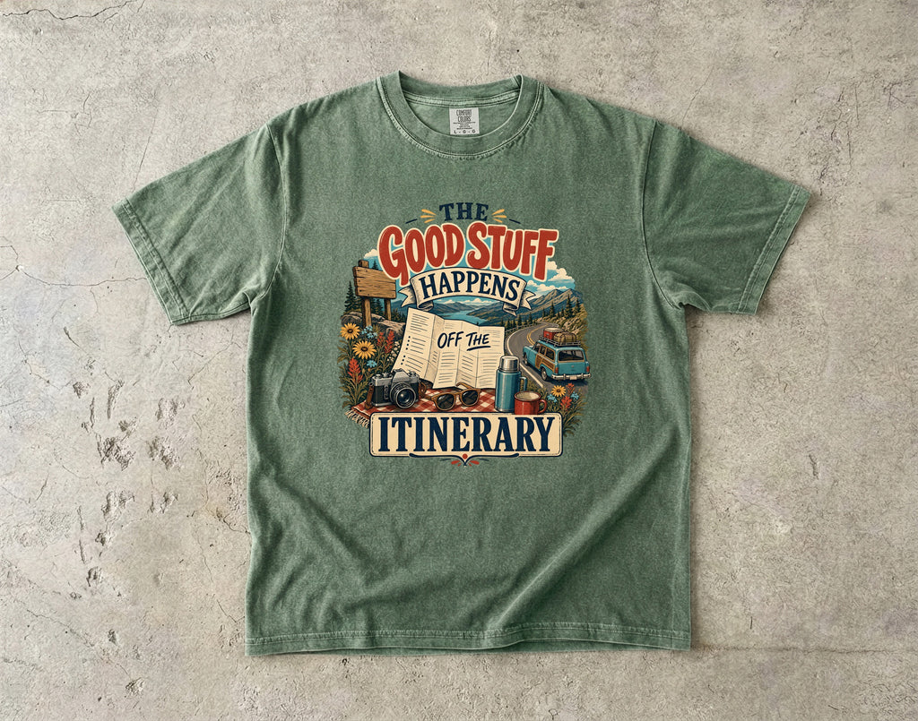 The Good Stuff Happens Off the Itinerary Travel Mom Shirt in Moss – flat lay