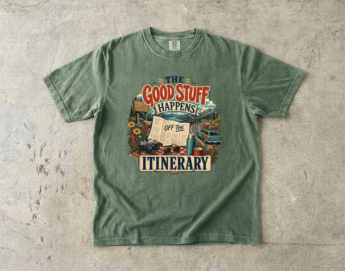 The Good Stuff Happens Off the Itinerary Travel Mom Shirt in Moss – flat lay