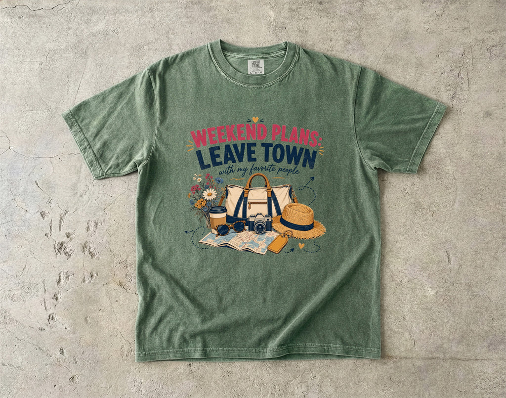 Weekend Plans Leave Town Girls Trip Shirt in Moss – flat lay