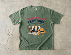 Weekend Plans Leave Town Girls Trip Shirt in Moss – flat lay