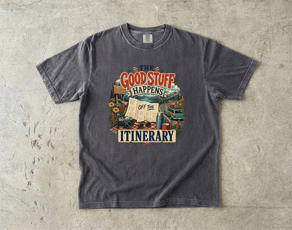 The Good Stuff Happens Off the Itinerary Travel Mom Shirt in Pepper – flat lay