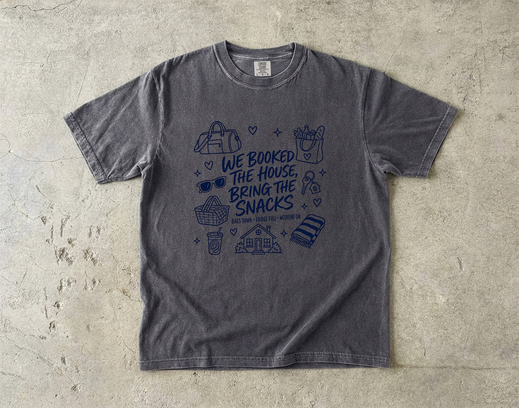 We Booked the House Bring the Snacks Family Getaway Shirt in Pepper – flat lay