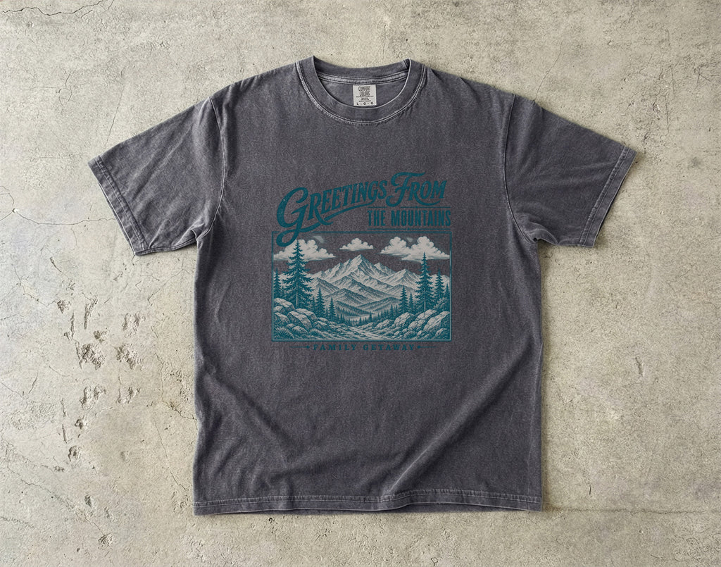 Greetings from the Mountains Family Getaway Shirt in Pepper – flat lay