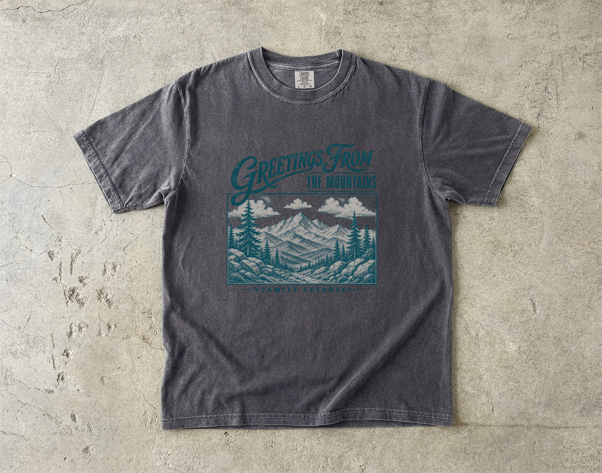 Greetings from the Mountains Family Getaway Shirt in Pepper – flat lay