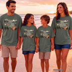 Trips We'll Talk About Forever Family Travel Shirt in Moss – worn on a family trip (AI-generated model photo)