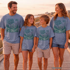 A Little Farther from Home Family Adventure Shirt in Blue Jean – worn on a family trip (AI-generated model photo)