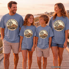 Desert Skies and Open Roads Youth Tee – Kids' Comfort Colors Travel Shirt in Blue Jean – worn on a family trip (AI-generated model photo)