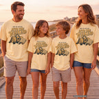 Out of Office Into the Weekend Family Getaway Shirt in Butter – worn on a family trip (AI-generated model photo)