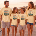 Home Is Wherever We Park It Youth Tee – Kids' Comfort Colors Camper Van Shirt in Butter – worn on a family trip (AI-generated model photo)