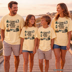 Camp More Scroll Less Youth Tee – Kids' Comfort Colors Camping Shirt in Butter – worn on a family trip (AI-generated model photo)