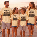 Checked In for the Weekend Youth Tee – Kids' Comfort Colors Cabin Weekend Shirt in Butter – worn on a family trip (AI-generated model photo)