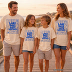 Lake Days Late Bedtimes Lake Vacation Shirt in Ivory – worn on a family trip (AI-generated model photo)