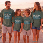 Greetings from the Mountains Family Getaway Shirt in Moss – worn on a family trip (AI-generated model photo)