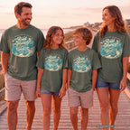 The Road Home Can Wait Road Trip Shirt in Moss – worn on a family trip (AI-generated model photo)