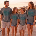 Out Here Making Family Memories Shirt in Pepper – worn on a family trip (AI-generated model photo)