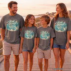 The Road Home Can Wait Youth Tee – Kids' Comfort Colors Road Trip Shirt in Pepper – worn on a family trip (AI-generated model photo)