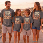 Dinner Tastes Better Out Here Camping Shirt in Pepper – worn on a family trip (AI-generated model photo)